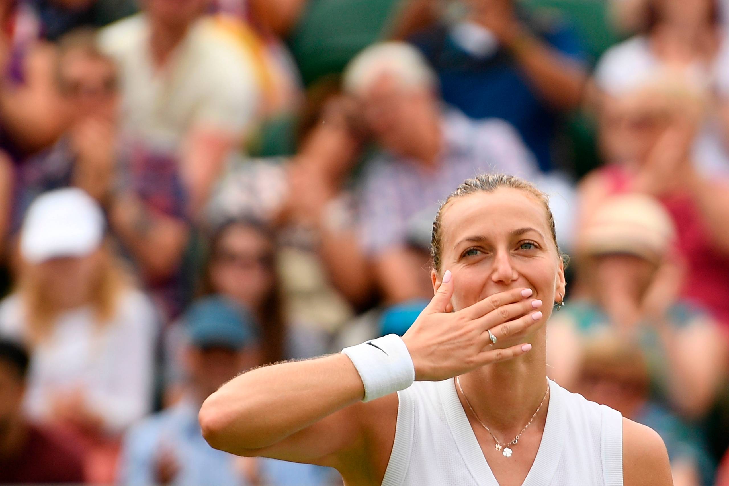 
    Czech Republic's Petra Kvitova celebrates beating Poland's Magda Linette during their women's singles third round match on the sixth day of the 2019 Wimbledon Championships at The All England Lawn Tennis Club in Wimbledon, southwest London, on July 6, 2019. (Photo by Daniel Leal-olivas/AFP) / RESTRICTED TO EDITORIAL USE
  