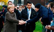 German Chancellor Angela Merkel greets visitors as she walks to the Chapel of Reconciliation before attending a memorial service as part of the central commemoration ceremony for the 30th anniversary of the fall of the Berlin Wall, on November 9, 2019 at the Berlin Wall Memorial at Bernauer Strasse in Berlin. - Germany on Saturday celebrates 30 years since the fall of the Berlin Wall ushered in the end of communism and national reunification, as the Western alliance that secured those achievements is increasingly called into question. (Photo by MICHELE TANTUSSI / AFP)