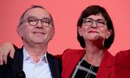 Saskia Esken (R) and Norbert Walter-Borjans celebrate on stage after the results of the vote for the SPD leadership at the Willy-Brandt Haus, the Social Democrats Party headquarters in Berlin, on November 30, 2019. - Germany's Deputy Chancellor and Finance Minister Olaf Scholz on November 30, 2019 lost the leadership race of his centre-left SPD party, throwing the future of Chancellor Angela Merkel's coalition into question. Scholz and his running mate Klara Geywitz obtained only 45.33 percent of the vote of the party's rank and file, while their challengers Norbert Walter-Borjans und Saskia Esken won 53.06 percent. (Photo by AXEL SCHMIDT / AFP)