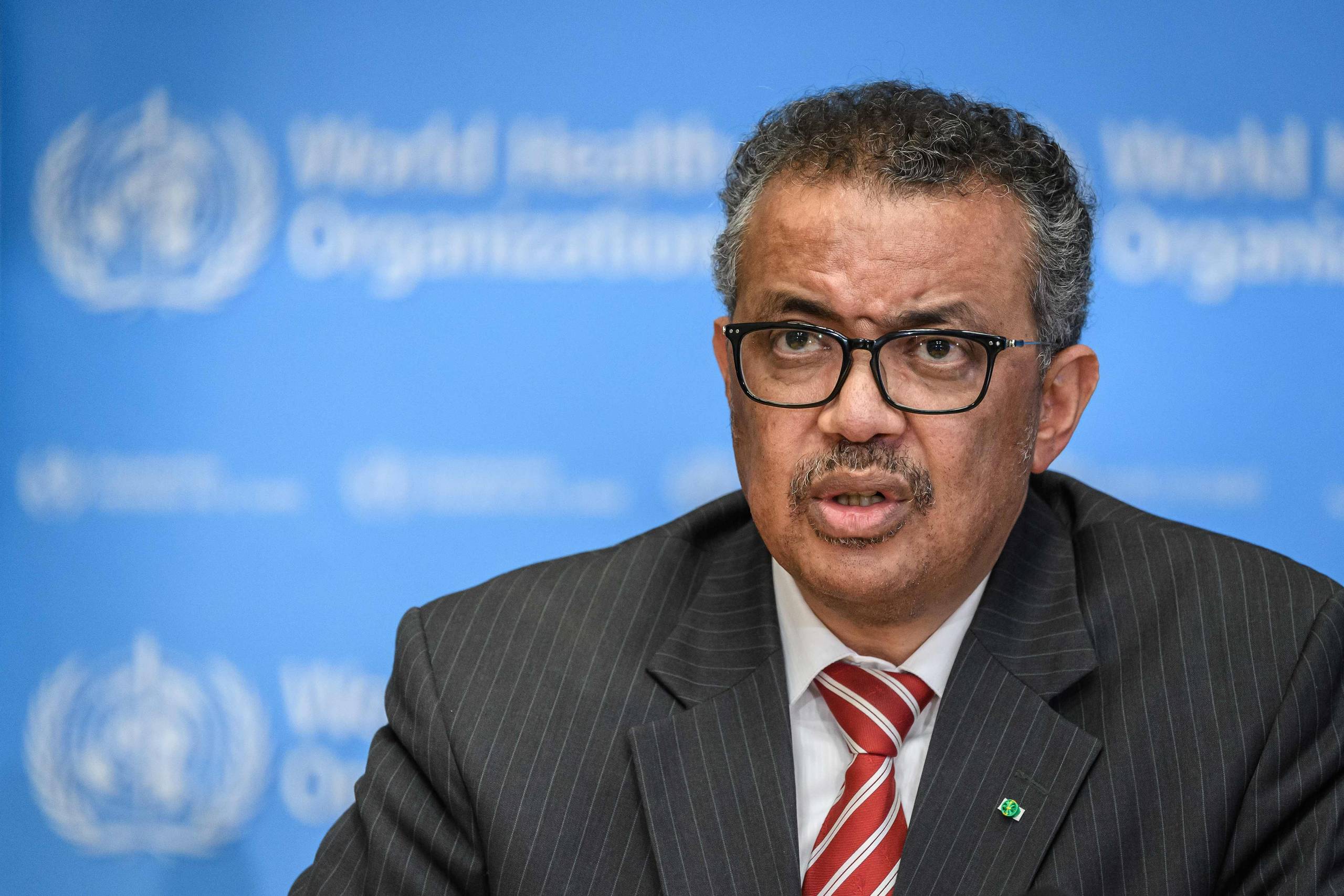     EDITORS NOTE: Graphic content / (FILES) In this file photo taken on March 11, 2020 World Health Organization (WHO) Director-General Tedros Adhanom Ghebreyesus attends a daily press briefing on COVID-19 virus at the WHO headquaters in Geneva. - The World Health Organization welcomed the news on March 20, 2020, that the Chinese city where the new coronavirus first emerged in December had for the first time reported no new cases in 24 hours."Yesterday, Wuhan reported no new cases for the first time since the outbreak started, " WHO chief Tedros Adhanom Ghebreyesus told a virtual news conference. (Photo by Fabrice Coffrini / AFP)  