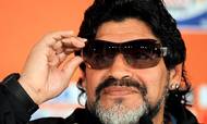 FILE PHOTO: Argentina's coach Diego Maradona tries on sunglasses before a news conference ahead of their June 22 World Cup soccer match against Greece, at the Loftus Versfeld Stadium in Pretoria, South Africa June 21, 2010. REUTERS/Enrique Marcarian/File Photo