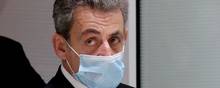 FILE PHOTO: Former French President Nicolas Sarkozy leaves the courtroom during his trial on charges of corruption and influence peddling, at Paris courthouse, France, December 7, 2020. REUTERS/Benoit Tessier/File Photo