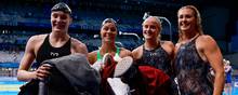 Julie Kepp Jensen (tv.), Pernille Blume, Signe Bro og Jeanette Ottesen smiler efter det indledende heat, der med en dansk rekord blev adgangskortet til den olympiske finale. Foto: Odd Andersen/AFP