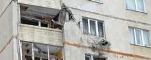 Her ses et bombet beboelseskompleks i Kharkiv den 26. februar 26. Foto: Sergey BOBOK / AFP.