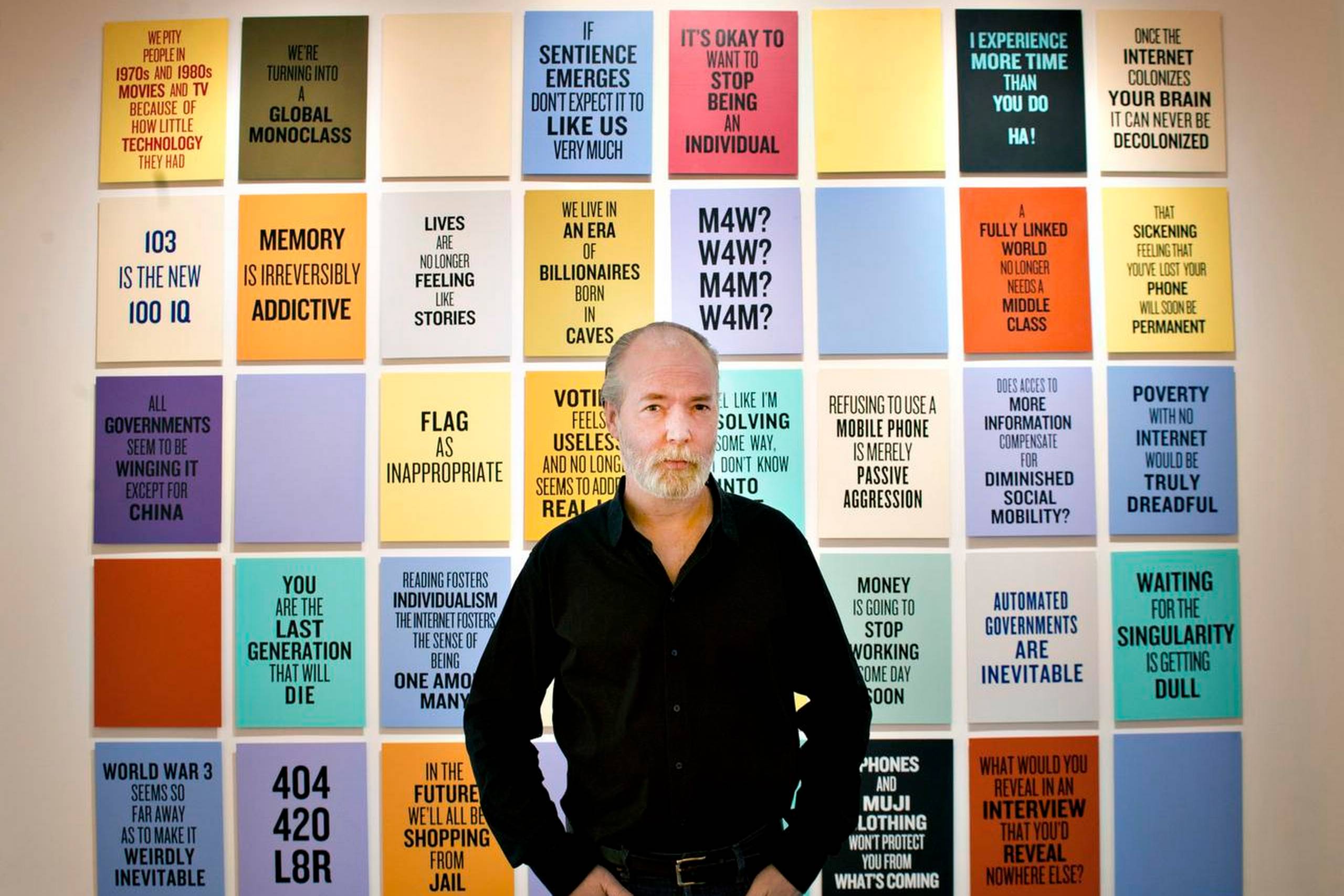 På billedet ses Douglas Coupland udstille slogans for det 21. århundrede i Toronto, Canada, i 2012. At skrive slogans har været et kunstnerisk projekt, som han har forfulgt i en længere årrække. Han har lavet 30 nye slogans til den nyligt overståede kunstmesse ”Chart Art Fair” i København, hvoraf 15 er blevet udvalgt til udstillingen. De kan også ses ophængt rundt omkring i København på husfacader, reklamesøjler m.m. Desuden er en tøjkollektion med disse slogans blevet lavet i samarbejde med tøjdesigneren Mads Nørgaard. Foto: Keith Beaty/Toronto Star/Getty Images