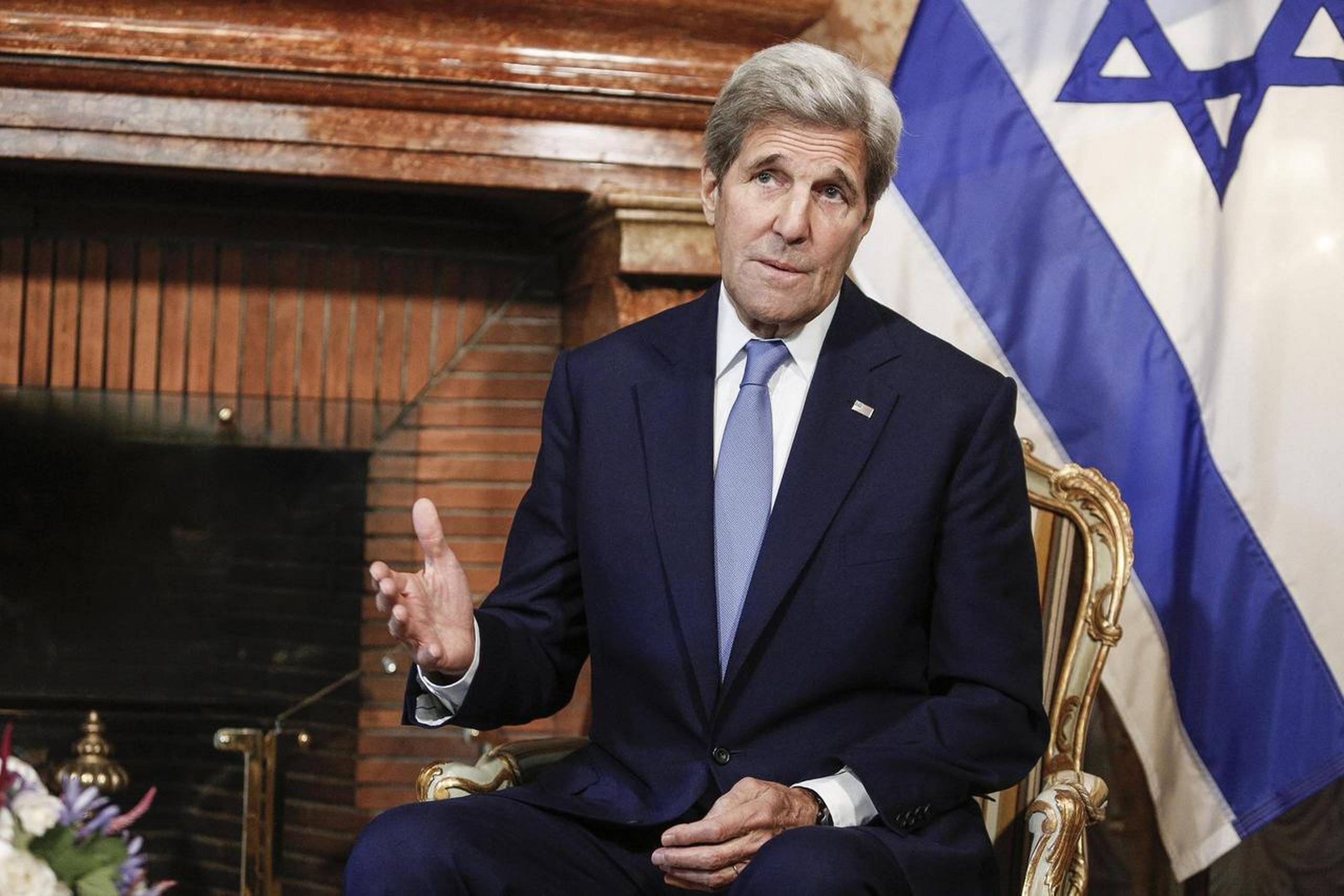 USA's udenrigsminister, John Kerry, afviser, at FN-resolution var brygget i USA. Han vil udtale sig om fredsproces onsdag. Foto: Giuseppe Lami/AP