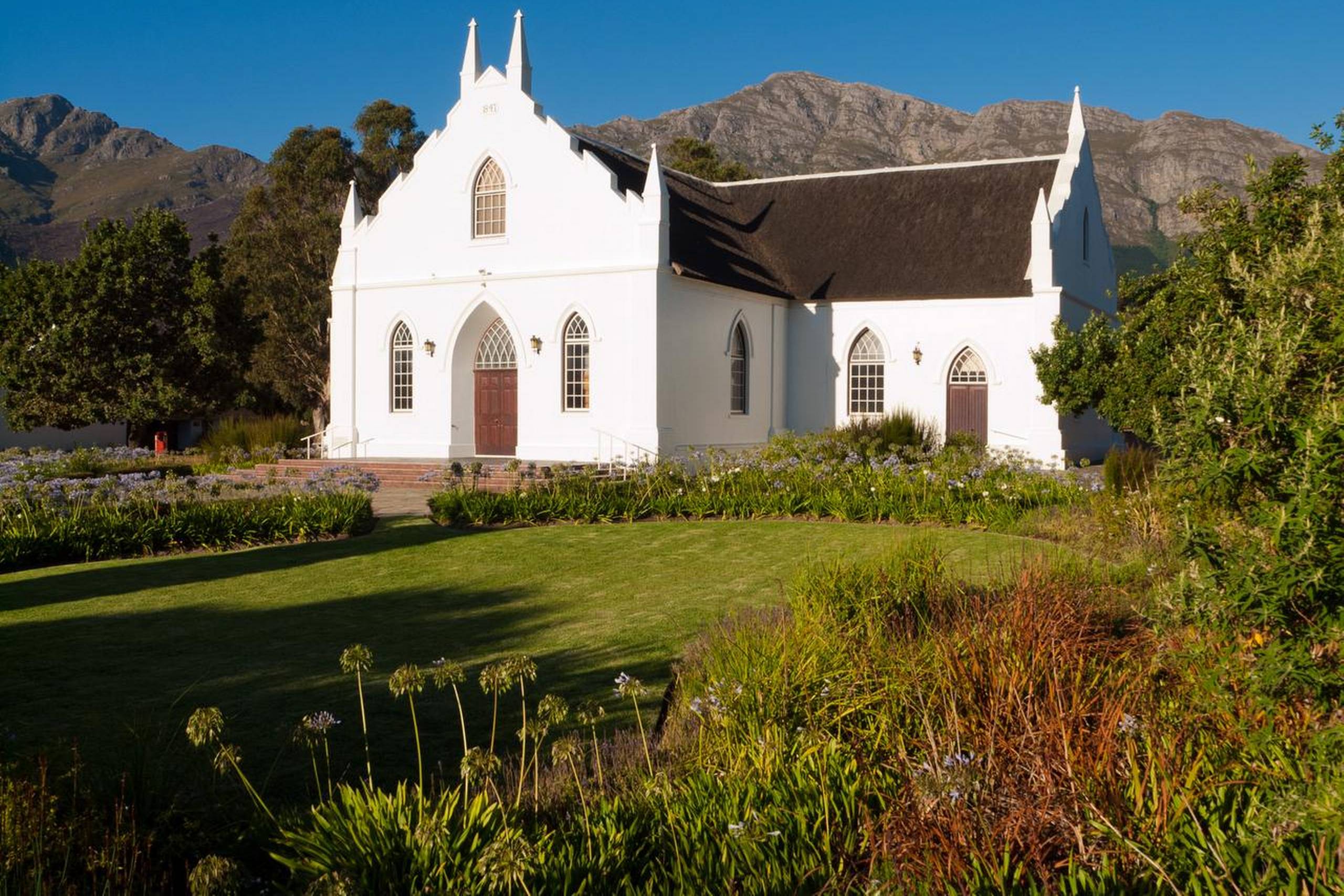 De første hollandske indvandrere i Sydafrika medbragte deres egen arkitektur, som udviklede sig til den særegne Cape Duch-stil. Her uden for Franschhoek. Foto: Getty Images/iStockphoto