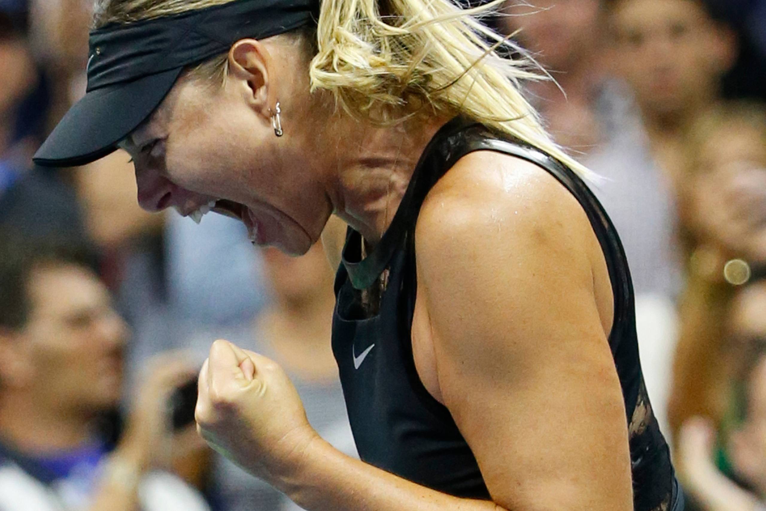 Maria Sharapova vandt overraskende over Simona Halep ved US Open. Foto: Kathy Willens/AP